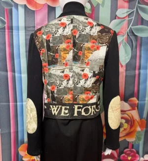 Back view of the Lest We Forget Jacket with bold “Lest We Forget” lettering and poppy design.
