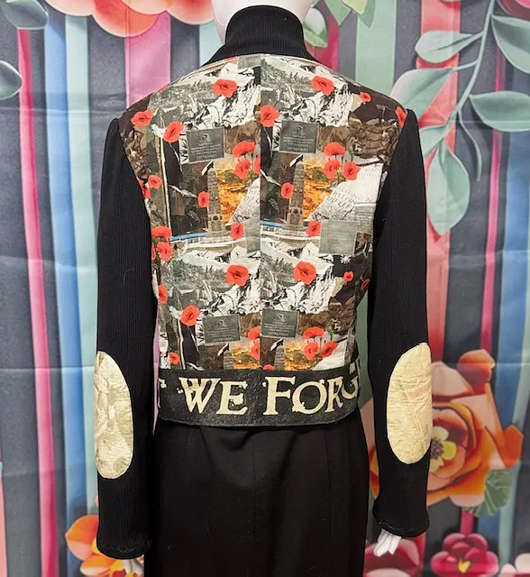Back view of the Lest We Forget Jacket with bold “Lest We Forget” lettering and poppy design.