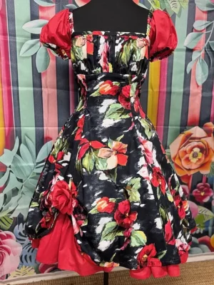 Front view of the Hot Ginger® Roses Are Red Dress showing red puff sleeves, floral pattern, and layered skirt detail.